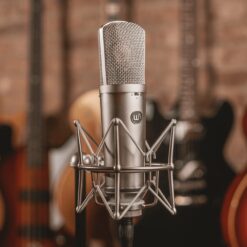 Warm_Audio_WA87_R2_-_Large_Diaphragm_Transformer-Balanced_Condenser_Microphone_Nickel_-_6_Lifestyle_with_Guitars_in_the_Background